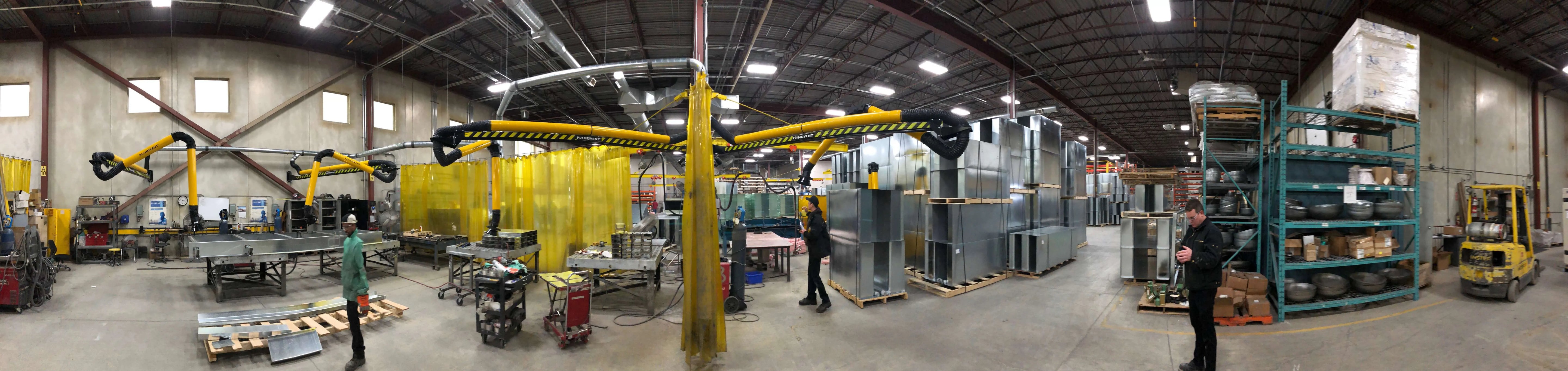 Picture of a manufacturing plant/workshop where multiple Remove The Fume fume extraction arms are present.