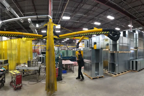Picture of a manufacturing plant/workshop where multiple Remove The Fume fume extraction arms are present.