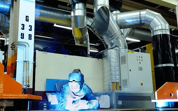 Welding in a room with Plymovent Push Pull System as an alternative to source extraction.