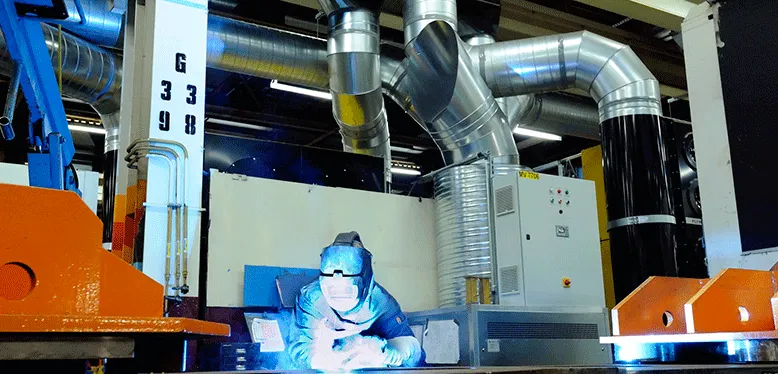 Welding in a room with Plymovent Push Pull System as an alternative to source extraction.