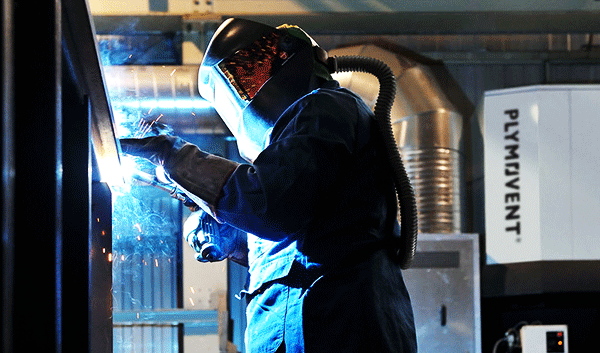 Gentleman welding with Plymovent Push Pull System in use to extract welding fumes.