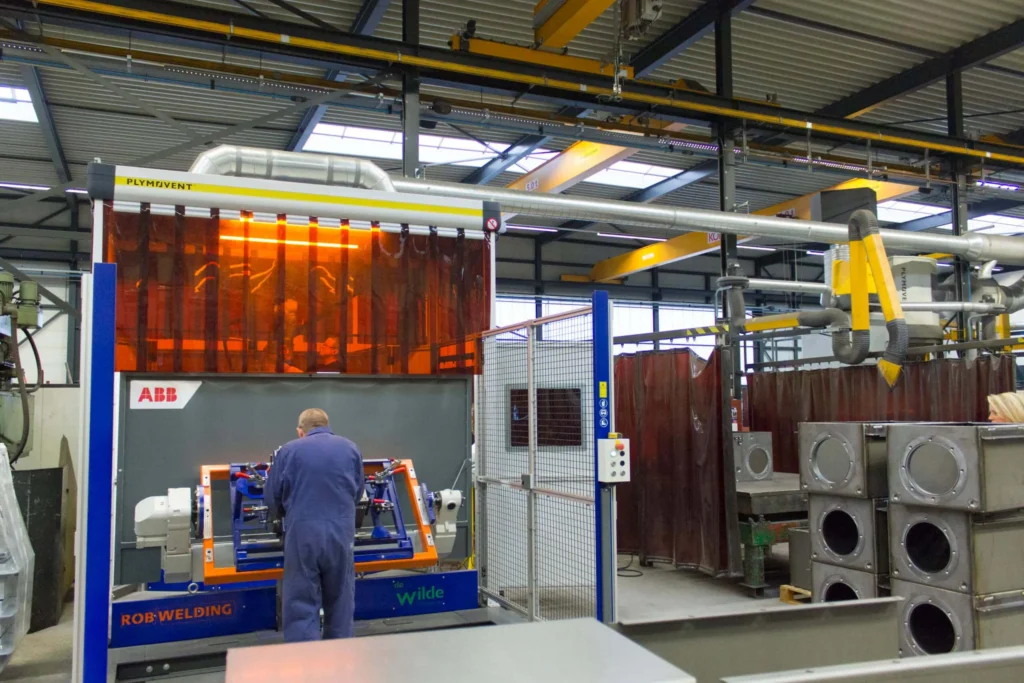 A man working under Plymovent's FlexHood.  